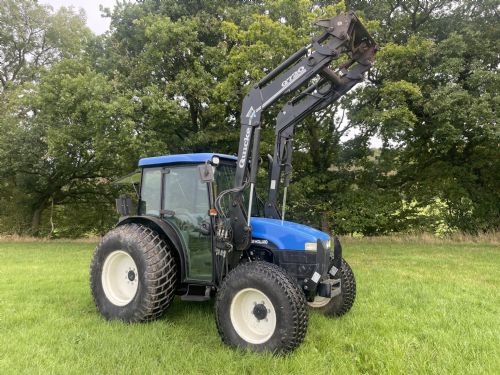 New Holland TN55D tractor with quicke loader for sale