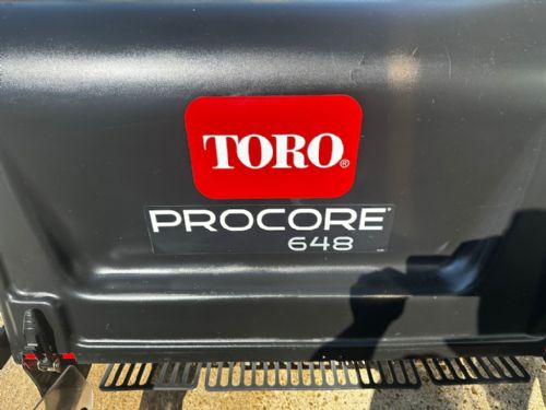 Toro Procore 648 Pedestrian aerator fitted with a core collector for sale